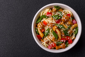 Delicious Asian cuisine dish with rice noodles, peppers, mushrooms and spices