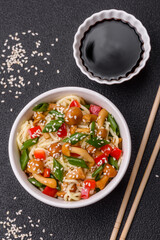 Delicious Asian cuisine dish with rice noodles, peppers, mushrooms and spices