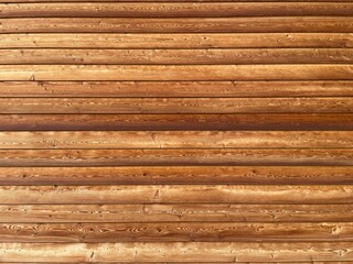 Brown wood texture background coming from natural tree. The wooden panel has a beautiful dark pattern, hardwood facade texture