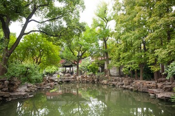 Pavilion of Listening to Billows in Yu Garden, Shanghai, China showing the lush botanical gardens.