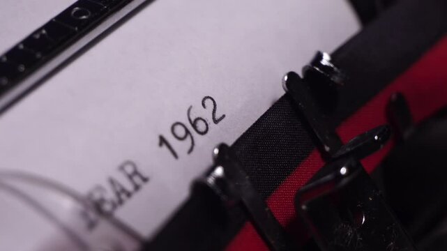 Year 1962, Typing on White Paper in Vintage Typewriter, Close Up