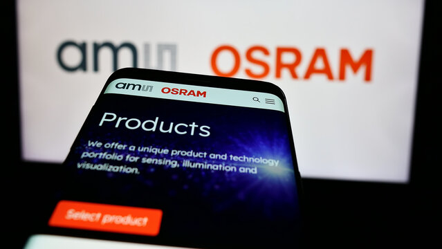 Stuttgart, Germany - 05-31-2024: Mobile phone with website of Austrian electronics company ams OSRAM AG in front of business logo. Focus on top-left of phone display.