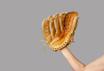 Hand of baseball player with glove isolated on gray. Baseball, active leisure, sports, championship.