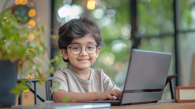 an attractive cute fair indian kid model A bright cute fair indian studing using laptop smile , stcok photo ,style raw , looking happy fully furnished luxary indoor room, 