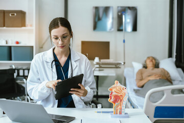 Female doctor consulting senior old patient filling form at consultation, talking to senior old patient filling signing medical paper at appointment visit in clinic..