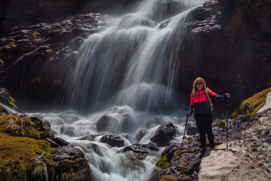 Hiker Standing by Lavaderos de la Reina Waterfall
