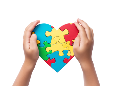 hands holding a puzzle in the shape of a heart