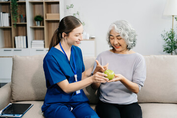 Caregiver doctor examine older patient use blood pressure gauge. woman therapist nurse at nursing...