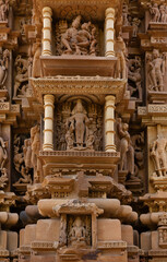 Fototapeta premium Ancient sculpture and intricate designs on the wall of Chitragupta Temple in the Khajuraho temple complex, India