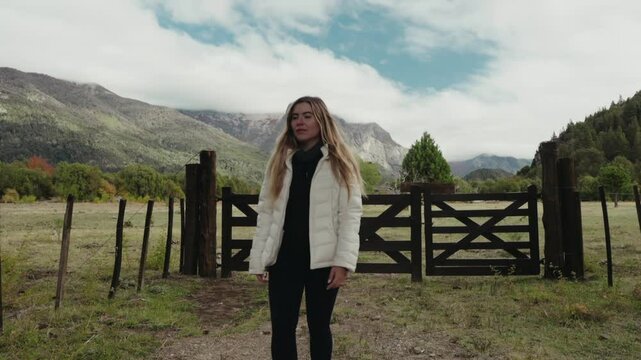 Woman walks away from farm door. Leave the country to start over. Leave the countryside. Freedom