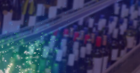 Image of lights over blurred alcohol shop in blue