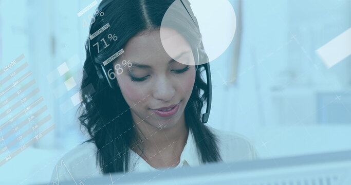 Image of statistics and data processing over biracial businesswoman using phone headset - Powered by Adobe