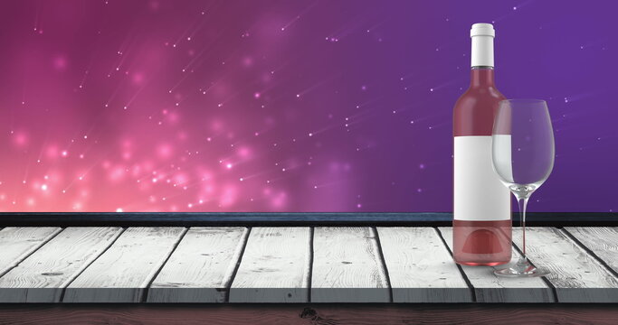 Image of bottle of rose wine over lights over violet background with wooden surface