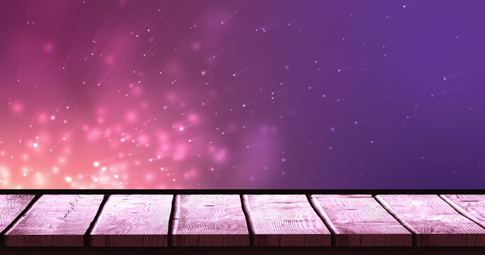 Image of lights over violet background with wooden surface - Powered by Adobe