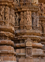 Sculptures carved on the wall of Vishwanath Temple  in the Khajuraho temple complex, India