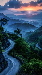 Winding Road Through Lush Green Mountains at Sunrise
