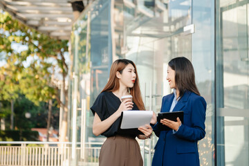 Fototapeta premium Young Asian business team creative businesspeople coworker, teamwork celebrating achievement and in planning design