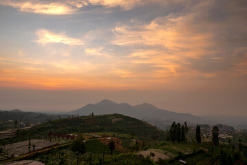 The sky is a beautiful orange color as the sun sets