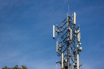 Telecommunication tower is a wireless communication technology in big cities on background sky