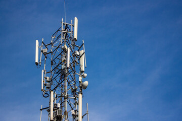 Telecommunication tower is a wireless communication technology in big cities on background sky