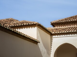 Roofs and towers of the Alcazaba fortress in Malaga, ornate geometrical Islamic architecture
