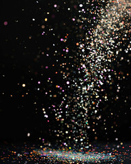 Falling pixie dust overlay layer black background, cascade of colorful glitter sparkles against a black background, magical and festive effect