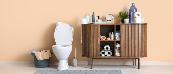 Stylish interior of modern restroom with different bath supplies