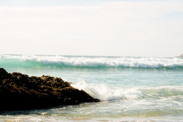 Waves hit the rocky beach