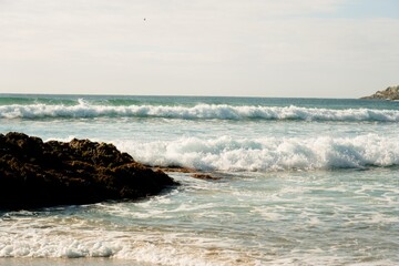 Waves hit the rocky beach