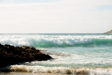 Waves hit the rocky beach