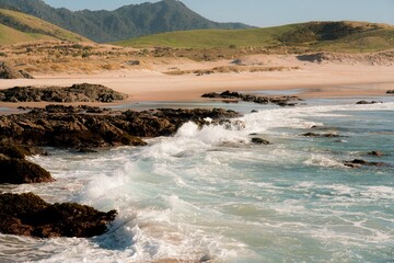 Waves hit the rocky beach