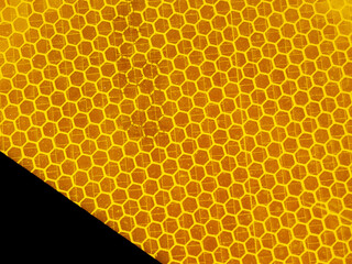 close-up yellow and black abstract background with hexagon shapes
