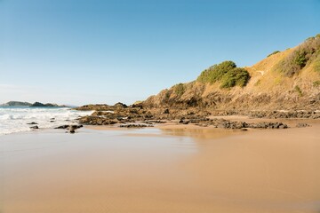 Waves hit the rocky beach