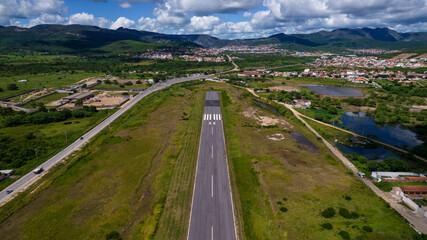 Airplane landing strip finals with mountains on the route