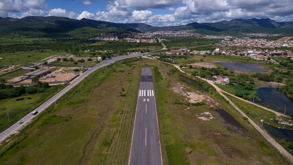 Airplane landing strip finals with mountains on the route