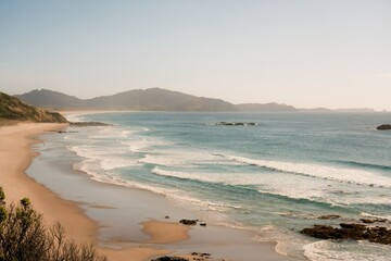 Waves hit the rocky beach