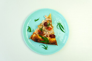 Homemade pizza with marijuana cannabis leaves on white wooden background. Fresh medical marijuana cannabis decorate on pizza. top view