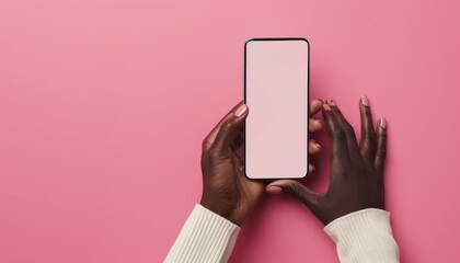 Black woman's hands holding smartphone with pink background and screen