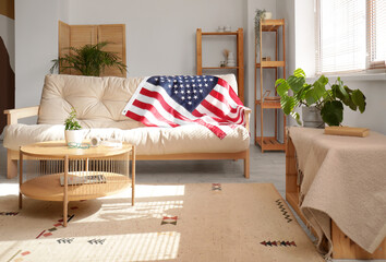 USA flag on light sofa at home
