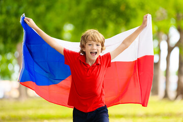 Child running with Czechia flag. Little Czech fan