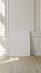 front view of one white blank canvas leaning against the wall 