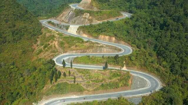 Aerial view of scenic winding mountain road on the Ha Giang Loop, North Vietnam