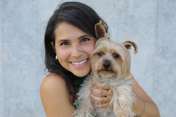 Pretty  woman with a very cute Yorkshire Terrier 