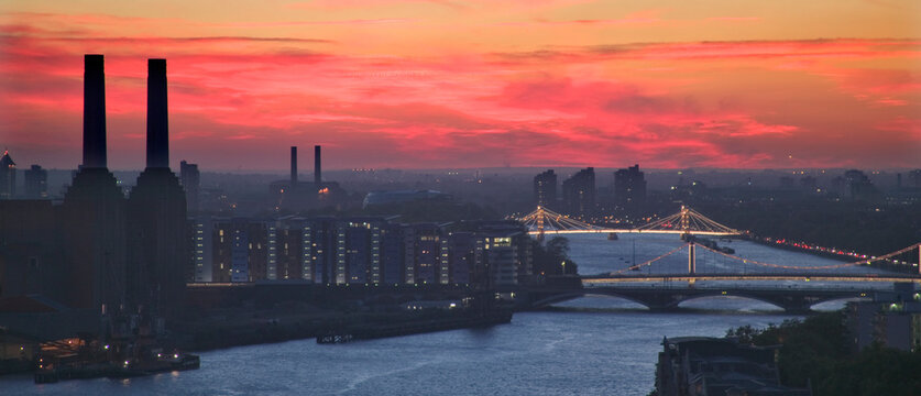 View of Chelsea Bridge London, River Thames, and Battersea Power Station at sunset, London, England.
