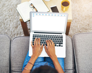 Fototapeta premium Hands, screen and laptop above on sofa in living room with person or journalist working from home. Education, student and typing on keyboard with studying, notes and fingers on couch in house.