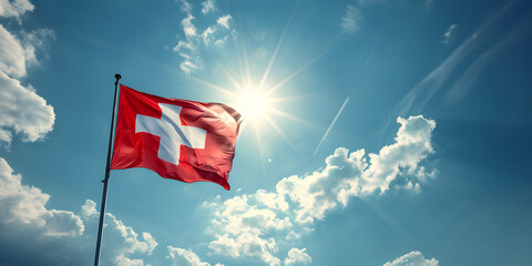 Flag of Switzerland waving in the wind, with a bright blue sky background