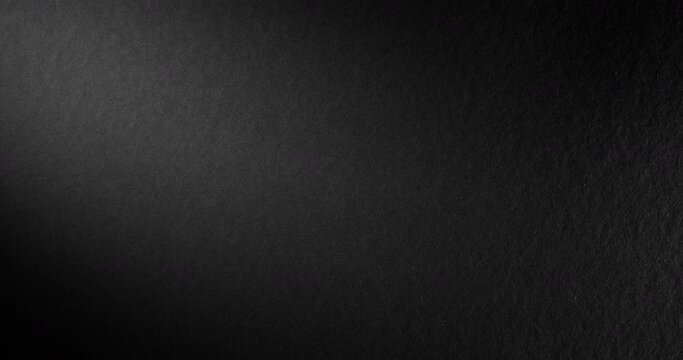 Black rough paper surface, slow moving. Use for background and texture. 