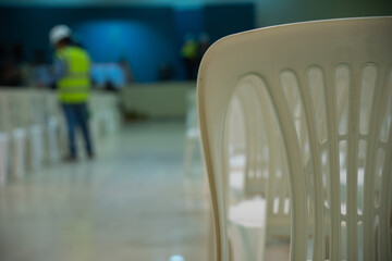 An engineer checking audio installations in a conference room.