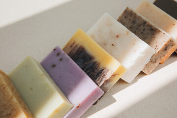 Handmade soap from natural ingredients, various herbs. Concept of sustainable use, bath products. Top view
