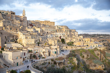 Naklejka premium panoramic view of Matera Sassi with curved road and valley, Italy 